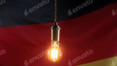 Preview: Edison light bulb on german flag background. Bad electricity supply, problems, crisis in Germany