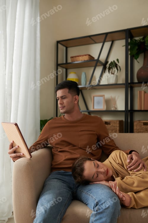 Preview: Young Couple Relaxing Together at Home