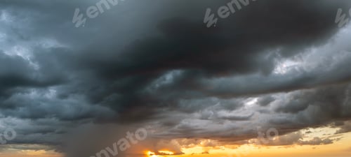 Preview: Rain shower at sunset. Water pouring down from stormy clouds during summer thunderstorm in Florida