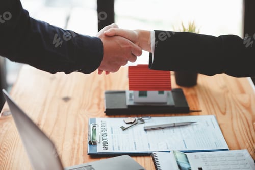 Preview: Businessmen shake hands to congratulate each other after discussing the contract.