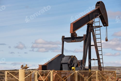 Preview: Rusty oil pumping machine. Pump jack. Petroleum extraction. Global warming