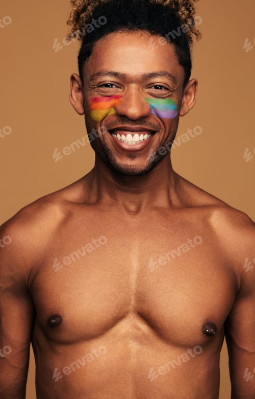Preview: Cheerful black gay with colorful paint on face