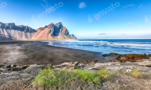 Preview: Fantastic sunny day and dramatic black sand beach on Stokksnes cape in Iceland.