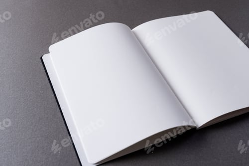 Preview: Close up of open book with copy space on grey background