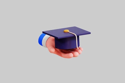 Preview: Hand holding miniature graduation cap