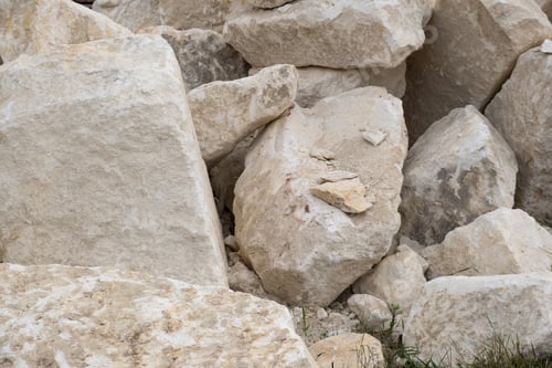 Preview: Big pile of large sand stones laying on the ground of construction site.