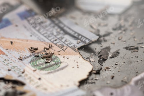 Preview: Remains of burnt one hundred dollar bills reduced to ashes