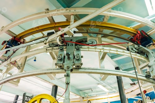 Preview: Madrid, Spain- August 25, 2019: Chain and mechanisms that move the steel cables of a cable car.