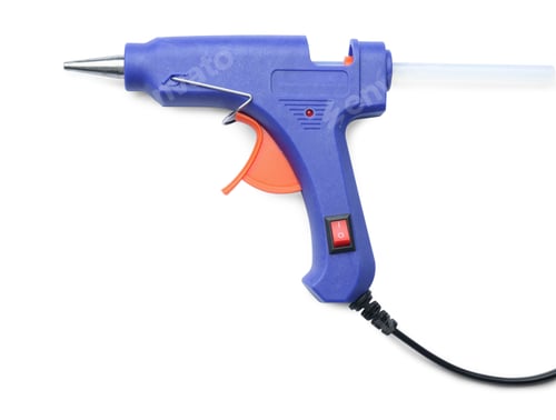 Preview: Blue glue gun with stick isolated on white, top view