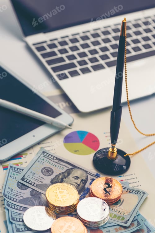 Preview: Bitcoin and Dollars on Desk with Technology