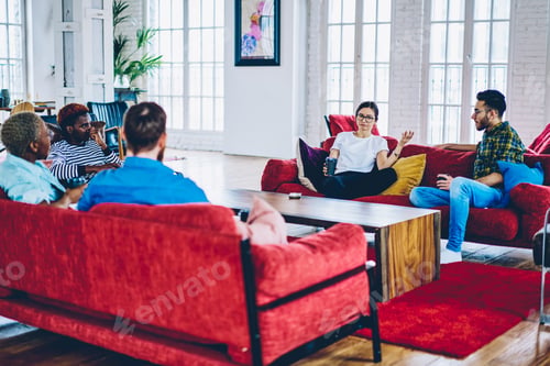 Preview: best friends communicating during rest pastime on cozy couch