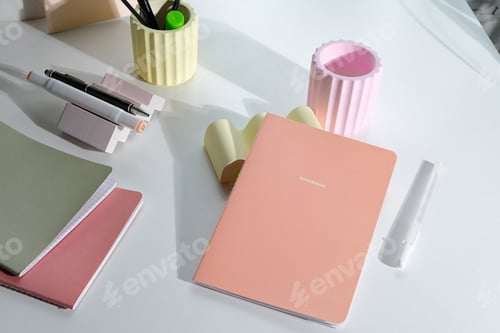 Preview: pastel colored stationery on white desk