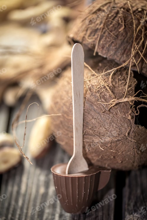 Preview: chocolate with coconut on wooden background