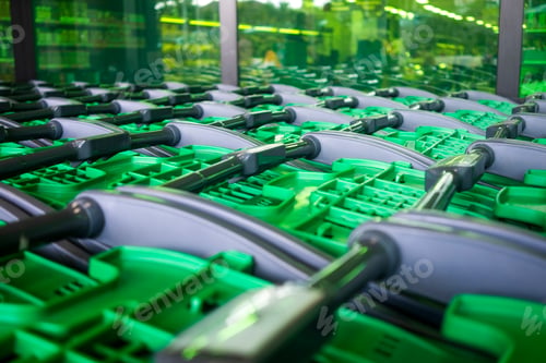 Preview: A row of empty shopping carts await customers outside the supermarket, green and grey color