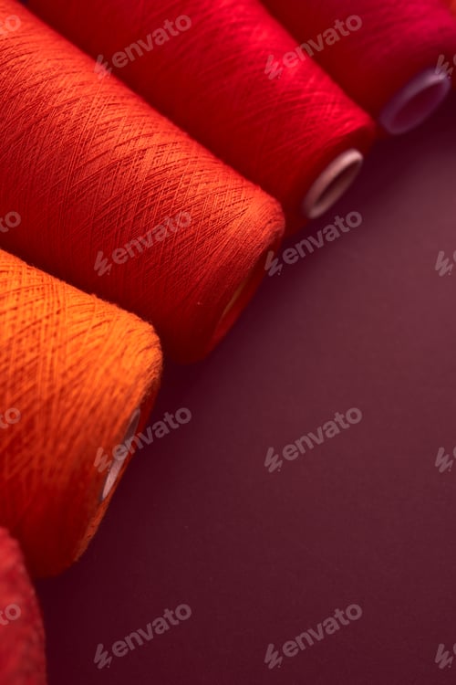 Preview: Composition of colorful vibrant wool threads from above. Autumn colours