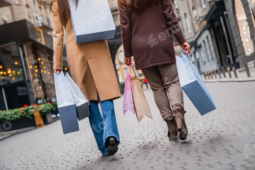 Preview: Cropped shot of female friends out for shopping in the city