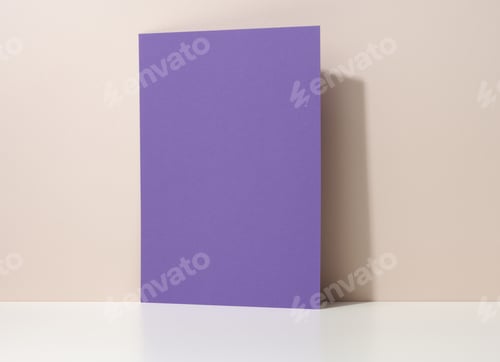 Preview: Blank purple cardboard sheet of paper with shadow on white table. Template for flyer, announcement