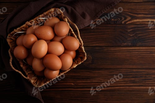 Preview: Basket of fresh farm chicken eggs on a wooden rustic background