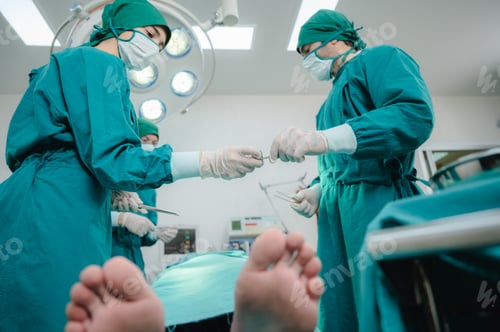 Preview: professional surgeon doctor team working in hospital operation room with surgery medical equipment