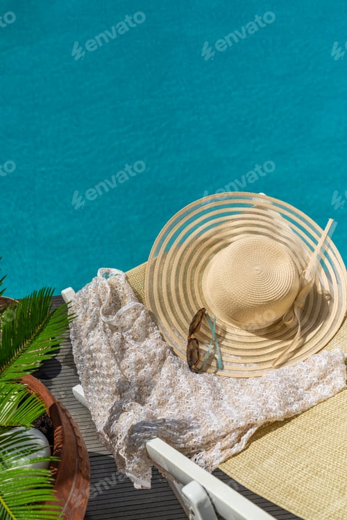 Preview: woman in luxury spa resort near the swimming pool.