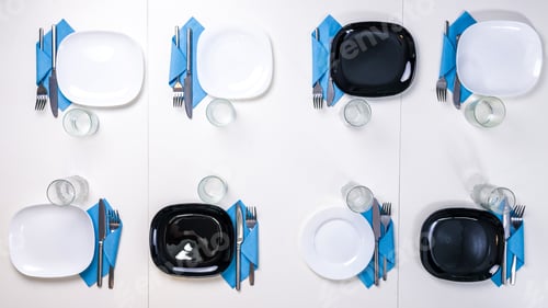 Preview: table setting for eight persons with white and black plates