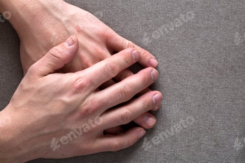 Preview: Close-up of male masculine young worker hands with rough skin and short fingernails