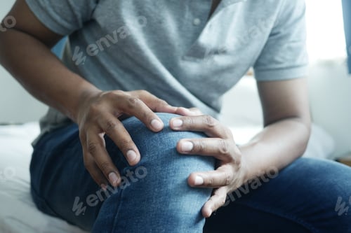 Preview: Close up on man suffering knee joint pain