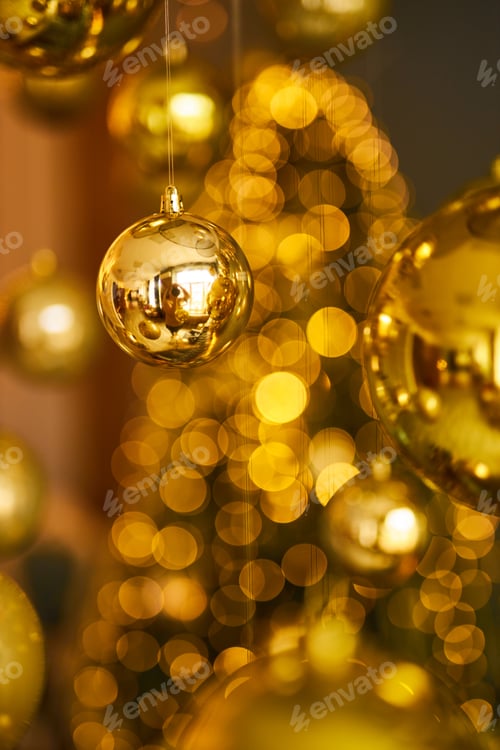 Preview: Gold Christmas balls on the shiny background. Golden Christmas decoration.