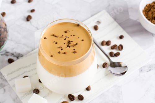 Preview: Dalgona coffee - trendy iced Korean coffee in a glass on the table. Social media drink.