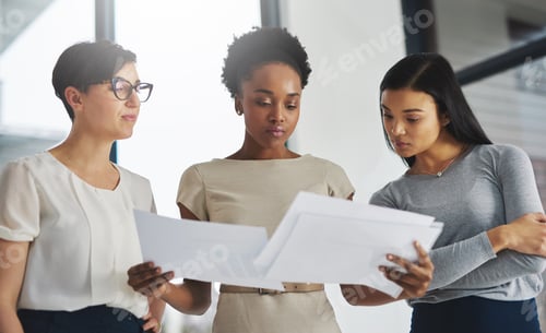 Preview: Big data for big business dreams. Shot of a group of businesswomen analyzing paperwork together.