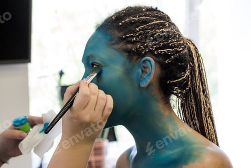 Preview: Makeup Artist applies ye shadows to a beautiful woman in Avatar style