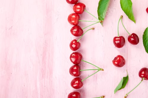 Preview: Fresh Cherries on a Pale Pink Background