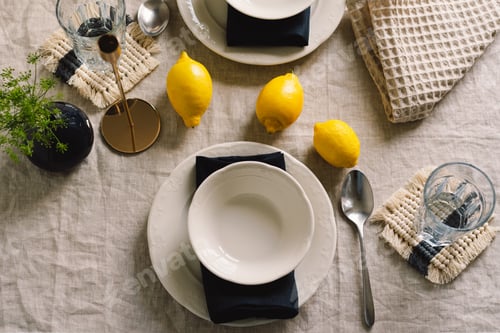 Preview: Vintage table setting with Linen napkins and yellow lemons.