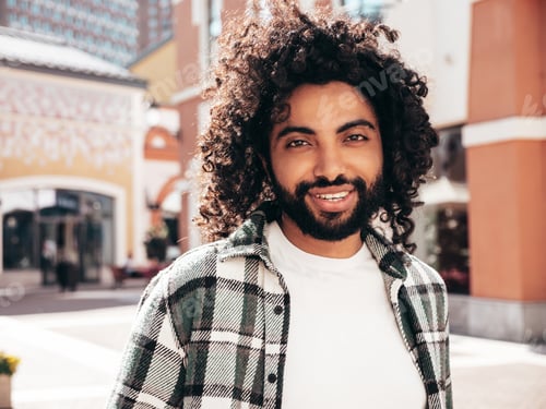 Preview: Handsome man posing outdoors at sunny day
