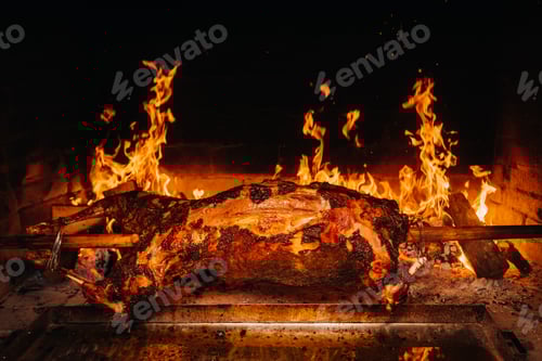 Preview: The lamb is cooked entirely on a spit on the fire. Cooking