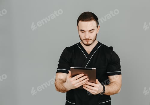 Preview: Healthcare Professional Works with Tablet in Studio