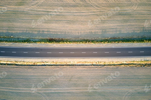 Preview: Aerial view of empty intercity road at sunset. Top view from drone of highway in evening