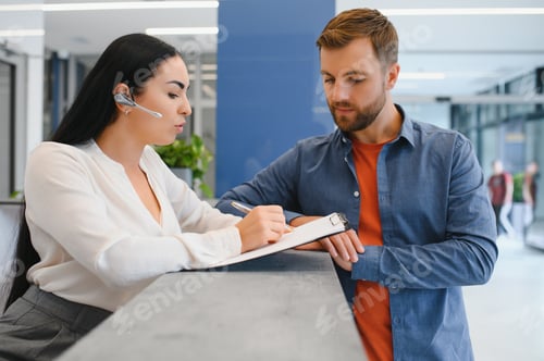 Preview: The employee of the beauty salon meets the client in the reception of a modern beauty salon