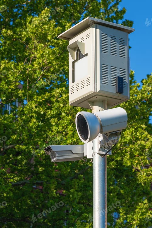 Preview: Traffic speed camera on post on sunny spring day, vertical image