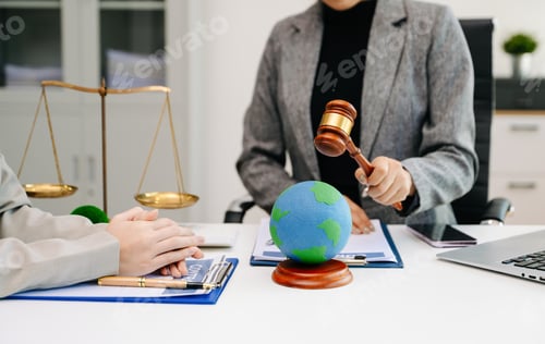 Preview: A lawyer presenting a green house model and earth globe with a gavel showing