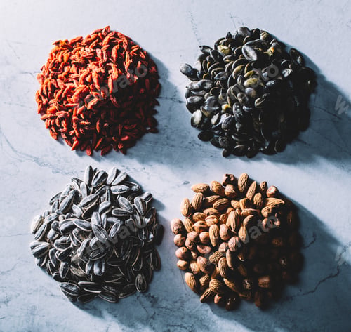 Preview: Four piles of superfoods on light background.