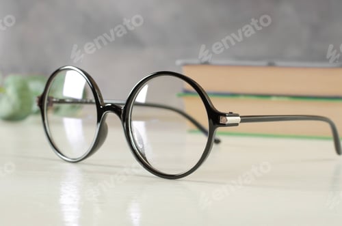 Preview: Round Glasses with Books on Light Table