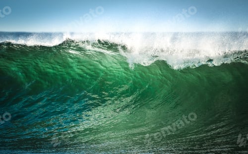 Preview: A wave of green water as the sun shines through it