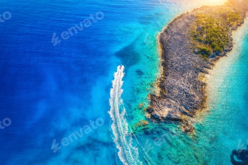 Preview: Aerial view of beautiful speed boat on the sea at sunset