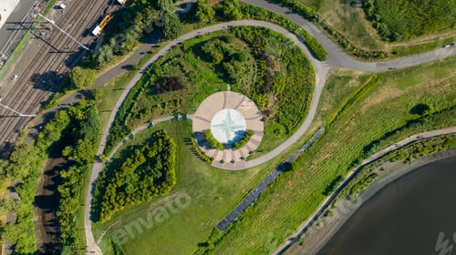 Preview: Aerial view of a green park by a lake