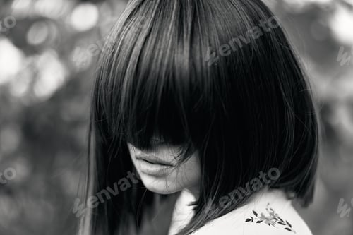 Preview: Ink and grace a striking black and white portrait of a woman with a tattoo on her back and shoulder