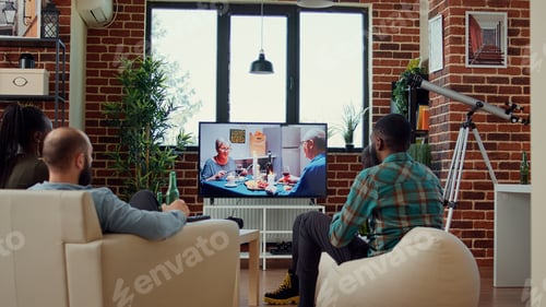 Preview: Multiethnic group of friends enjoying movie on tv channel