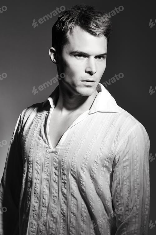 Preview: Classic handsomeness. Black and white studio portrait of a handsome young man.