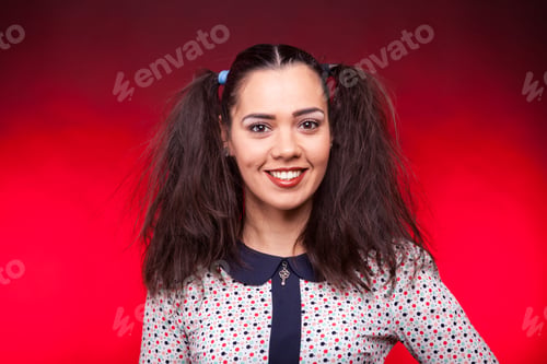 Preview: Smiling happy woman lookign at the camera