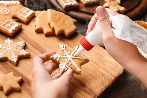 Preview: Decorating Christmas bakery. Woman glazing homemade cookies